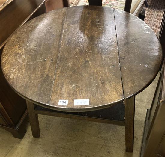 An 18th / 19th century circular oak cricket table, 70cm diameter, height 63cm